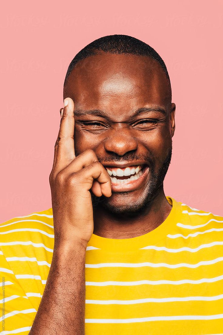 Portrait_Of_Handsome_Black_Man_Looking_At_Camera_While_Laughing__by_Stocksy_Contributor__VICTOR_TORRES.jpg